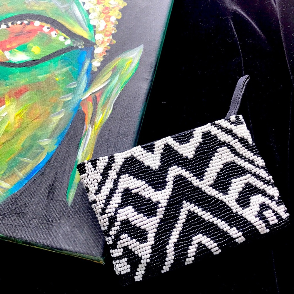 Brand new  Chico’s black and white beaded clutch.